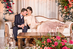 Indian couple posing at reception stage . Indian couple posing at reception stage .
