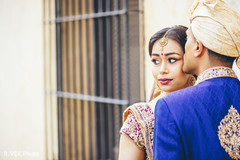 Indian bride wearing the tikka and bindi during the photo shoot. Indian bride wearing the tikka and bindi during the photo shoot.