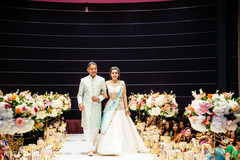 Bridesmaid and groomsman making their entrance to the ceremony. Bridesmaid and groomsman making their entrance to the ceremony.