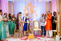 Maharani and Indian groom holding hands during the rituals. Maharani and Indian groom holding hands during the rituals.