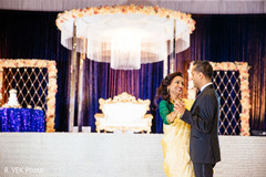 Indian groom dancing with his mother at the reception. Indian groom dancing with his mother at the reception.