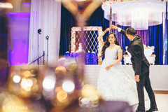 Indian bride and groom having their first dance during the reception. Indian bride and groom having their first dance during the reception.