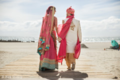 Maharani and rajah on their pink lehenga and sherwani. Maharani and rajah on their pink lehenga and sherwani.