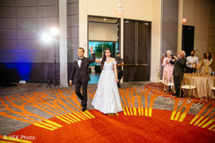 Indian bride and groom making their entrance to the reception. Indian bride and groom making their entrance to the reception.