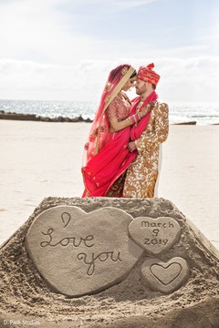 Indian couple posing by the beach capture. Indian couple posing by the beach capture.