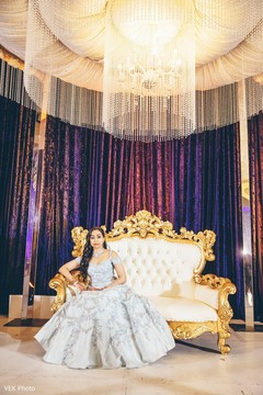 Maharani wearing the white lengha during pictures.