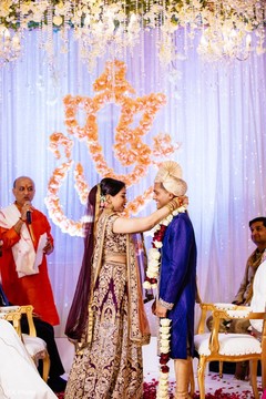 Maharani putting the garland on the Raja during the ceremony. Maharani putting the garland on the Raja during the ceremony.