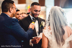 The groom reading his wedding vows during the ceremony The groom reading his wedding vows during the ceremony