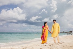 Maharani and groom walking on the beach Maharani and groom walking on the beach