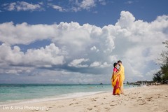 Maharani and groom holding each other at the beach Maharani and groom holding each other at the beach