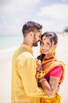 Maharani and groom sharing a moment in front of the ocean Maharani and groom sharing a moment in front of the ocean