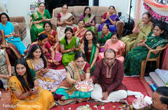 Indian family sitting together for pre wedding ritual. Indian family sitting together for pre wedding ritual.