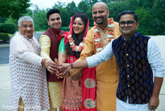 Maharani and relatives posing for picture holding a candle. Maharani and relatives posing for picture holding a candle.