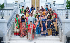 Indian couple with relatives in Sangeet photo shoot. Indian couple with relatives in Sangeet photo shoot.