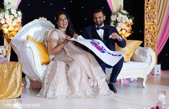Maharani and her groom laughing with a Taco bell sign. Maharani and her groom laughing with a Taco bell sign.