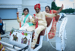 Indian groom in carriage with Indian family. Indian groom in carriage with Indian family.