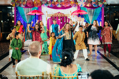 Indian relatives dancing for Indian bride and groom at sangeet. Indian relatives dancing for Indian bride and groom at sangeet.