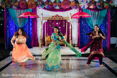 Maharani with bridesmaids dancing at sangeet stage. Maharani with bridesmaids dancing at sangeet stage.