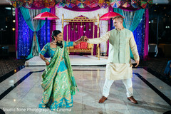 Indian couple dancing on marble sangeet dance floor. Indian couple dancing on marble sangeet dance floor.