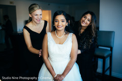 Indian bride ready on her white dress for ceremony. Indian bride ready on her white dress for ceremony.