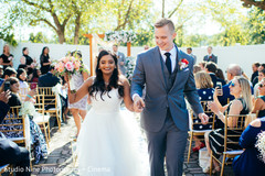 Indian couple walking down the aisle capture. Indian couple walking down the aisle capture.
