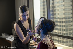 Indian bridal getting her makeup done for ceremony. Indian bridal getting her makeup done for ceremony.
