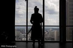 Indian grooms silhouette looking out the window picture. Indian grooms silhouette looking out the window picture.