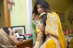 Indian bride getting ready for her haldi party. Indian bride getting ready for her haldi party.