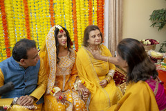 Indian bridal relatives during the haldi ritual. Indian bridal relatives during the haldi ritual.