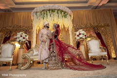 Indian couple posing on their golden wedding stage. Indian couple posing on their golden wedding stage.