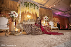 Indian bride sitting on her Indian wedding reception stage. Indian bride sitting on her Indian wedding reception stage.