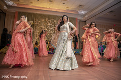 Maharani with bridesmaids dancing on stage. Maharani with bridesmaids dancing on stage.