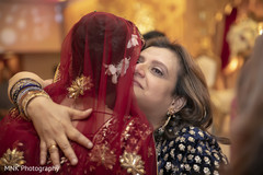 Indian bride's mother saying goodbye. Indian bride's mother saying goodbye.