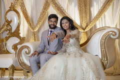 Indian couple showing their rings at their wedding reception. Indian couple showing their rings at their wedding reception.
