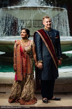 Indian lovebirds posing next to a fountain. Indian lovebirds posing next to a fountain.