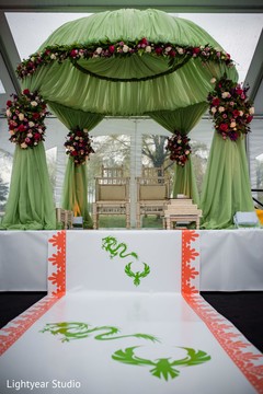 Indian Chinese wedding ceremony aisle green and orange decor. Indian Chinese wedding ceremony aisle green and orange decor.
