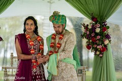 Indian bride and chinese groom at the joining of hands ritual. Indian bride and chinese groom at the joining of hands ritual.