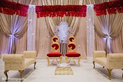 Red and golden chairs surrounded by drapes and lightning. Red and golden chairs surrounded by drapes and lightning.