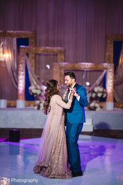 Newlywed Indian couple dancing at the reception Newlywed Indian couple dancing at the reception