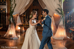 Indian bride and groom dancing at reception dance floor. Indian bride and groom dancing at reception dance floor.