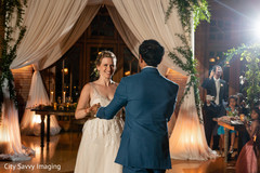 Indian groom dancing with bride on her reception outfit. Indian groom dancing with bride on her reception outfit.
