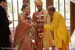 Indian bride holding with groom sacred items. Indian bride holding with groom sacred items.