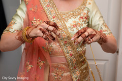 Maharani putting on her kundan choker necklace. Maharani putting on her kundan choker necklace.