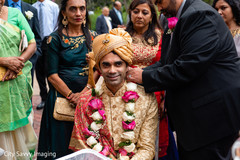 Indian groom with his pink and white garland. Indian groom with his pink and white garland.
