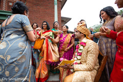Indian groom with relatives at milni celebration. Indian groom with relatives at milni celebration.