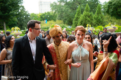 Indian groom walking in to ceremony with bride's relatives. Indian groom walking in to ceremony with bride's relatives.