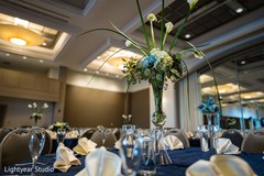 Indian chinese wedding table calla lilies with blue flowers. Indian chinese wedding table calla lilies with blue flowers.