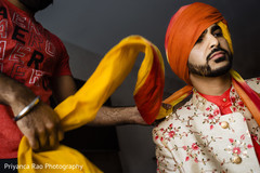 Indian groom getting his turban ready Indian groom getting his turban ready