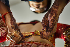 Indian relative helping Maharani with her wedding lengha Indian relative helping Maharani with her wedding lengha