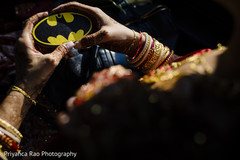 Maharani holding a Batman logo in her henna stained hands Maharani holding a Batman logo in her henna stained hands